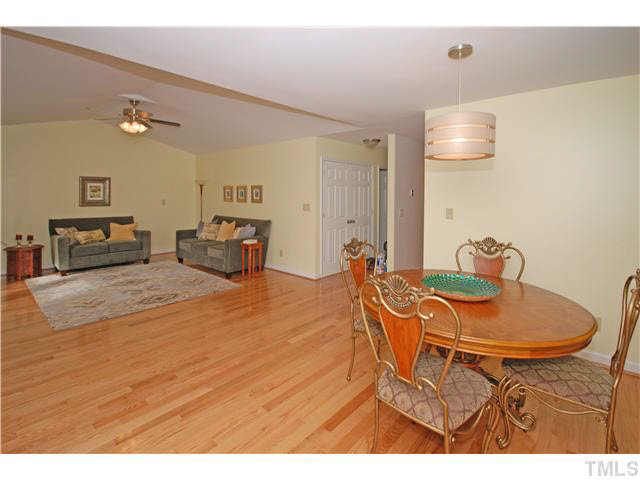 1072 Mills Street Raleigh, NC 27608 - Photo 9 of 25 a dining room with furniture and a window