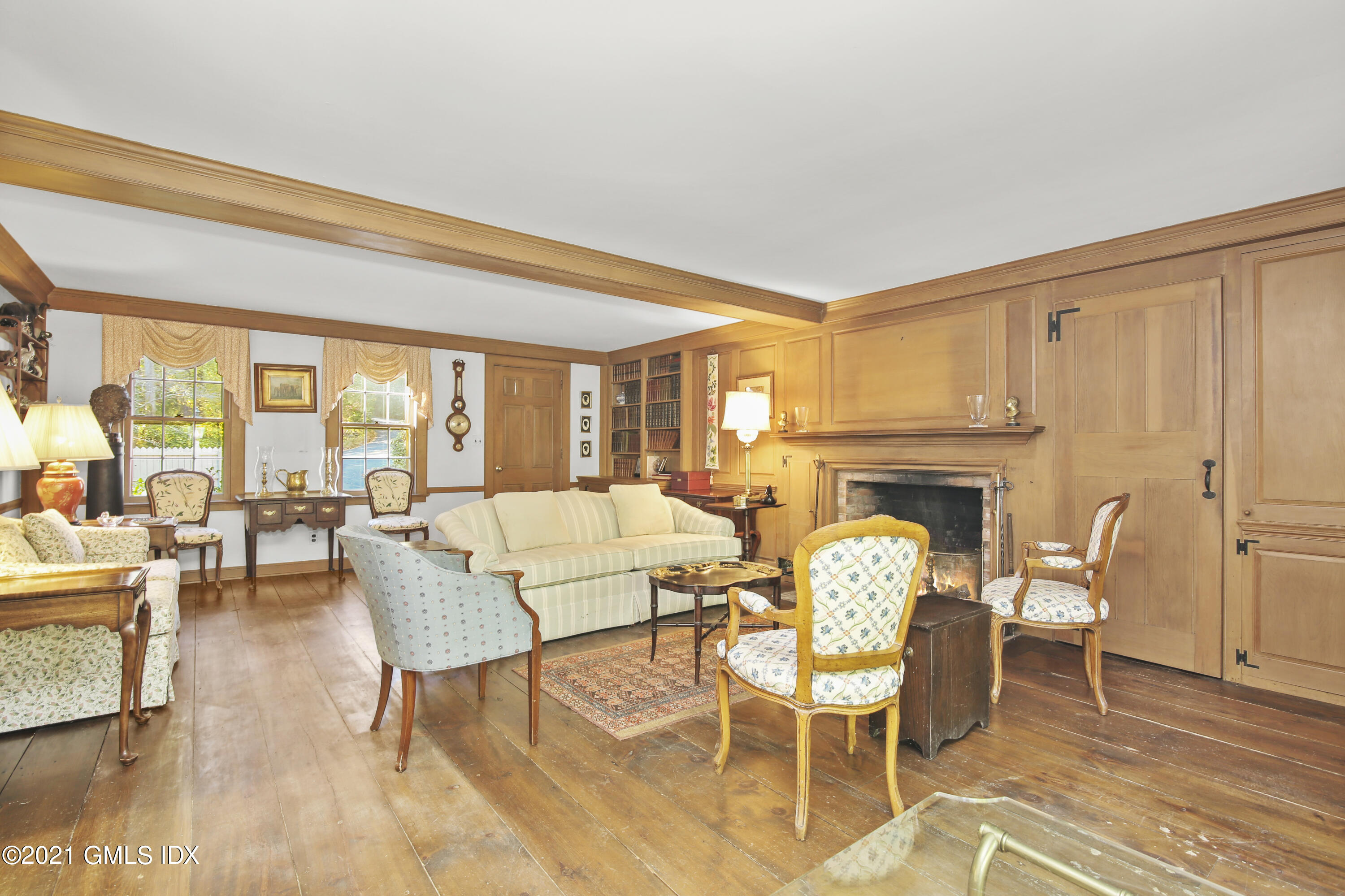 117 Dingletown Road Greenwich, CT 06830 - Photo 14 of 25 a dining room with furniture a fireplace and wooden floor