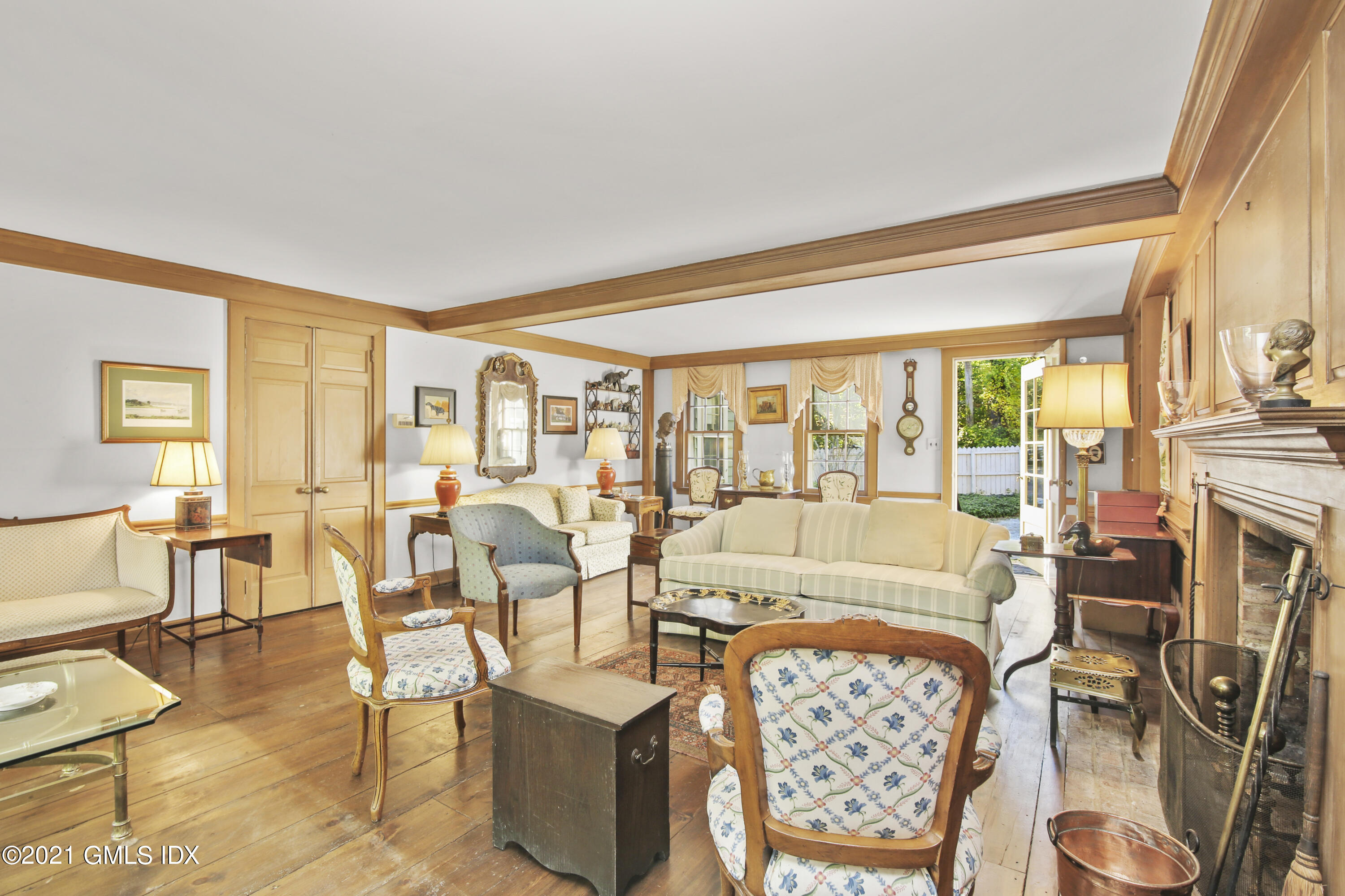 117 Dingletown Road Greenwich, CT 06830 - Photo 16 of 25 a living room with fireplace furniture and a large window
