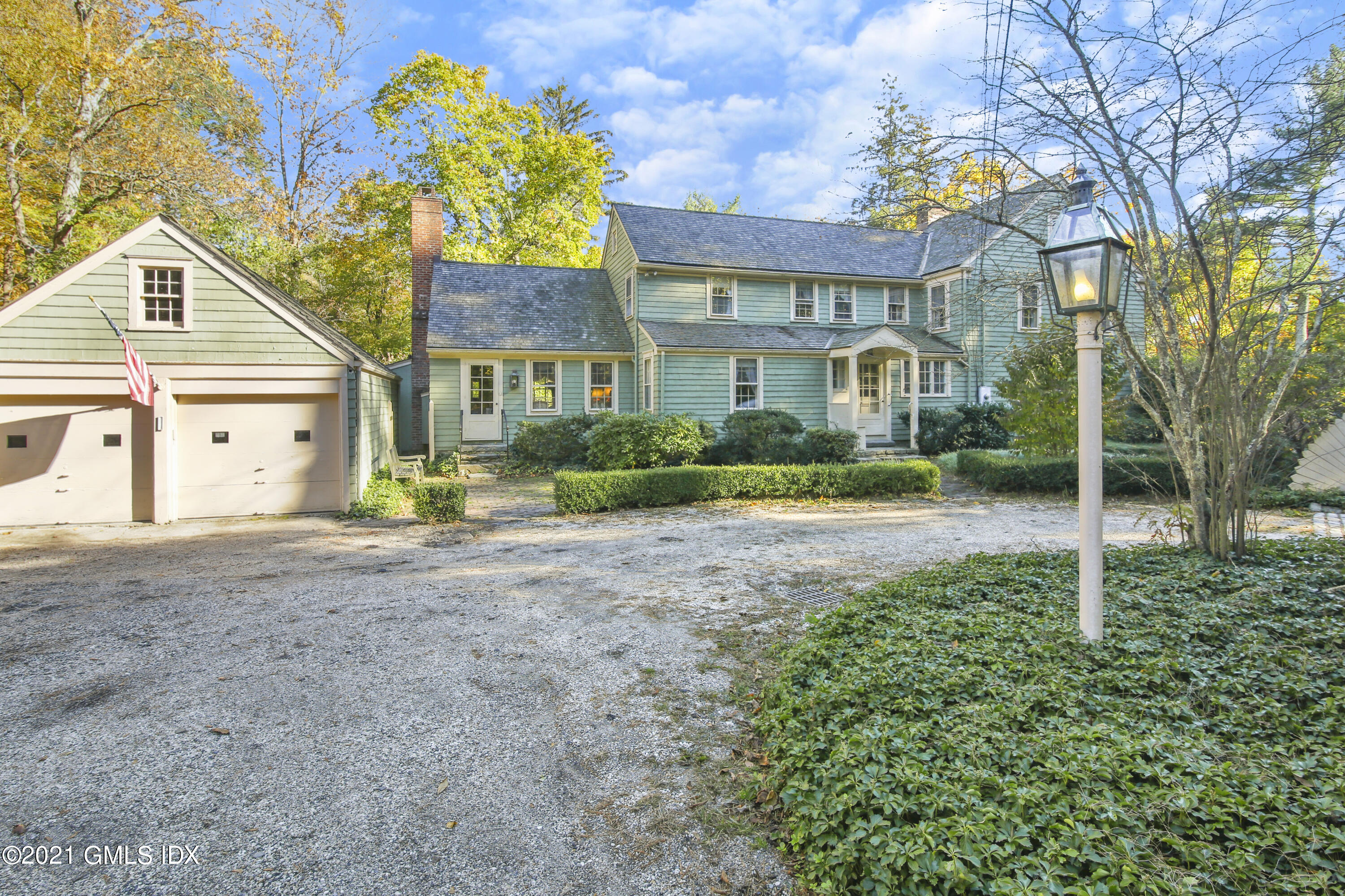 117 Dingletown Road Greenwich, CT 06830 - Photo 18 of 25 a front view of a house with garden