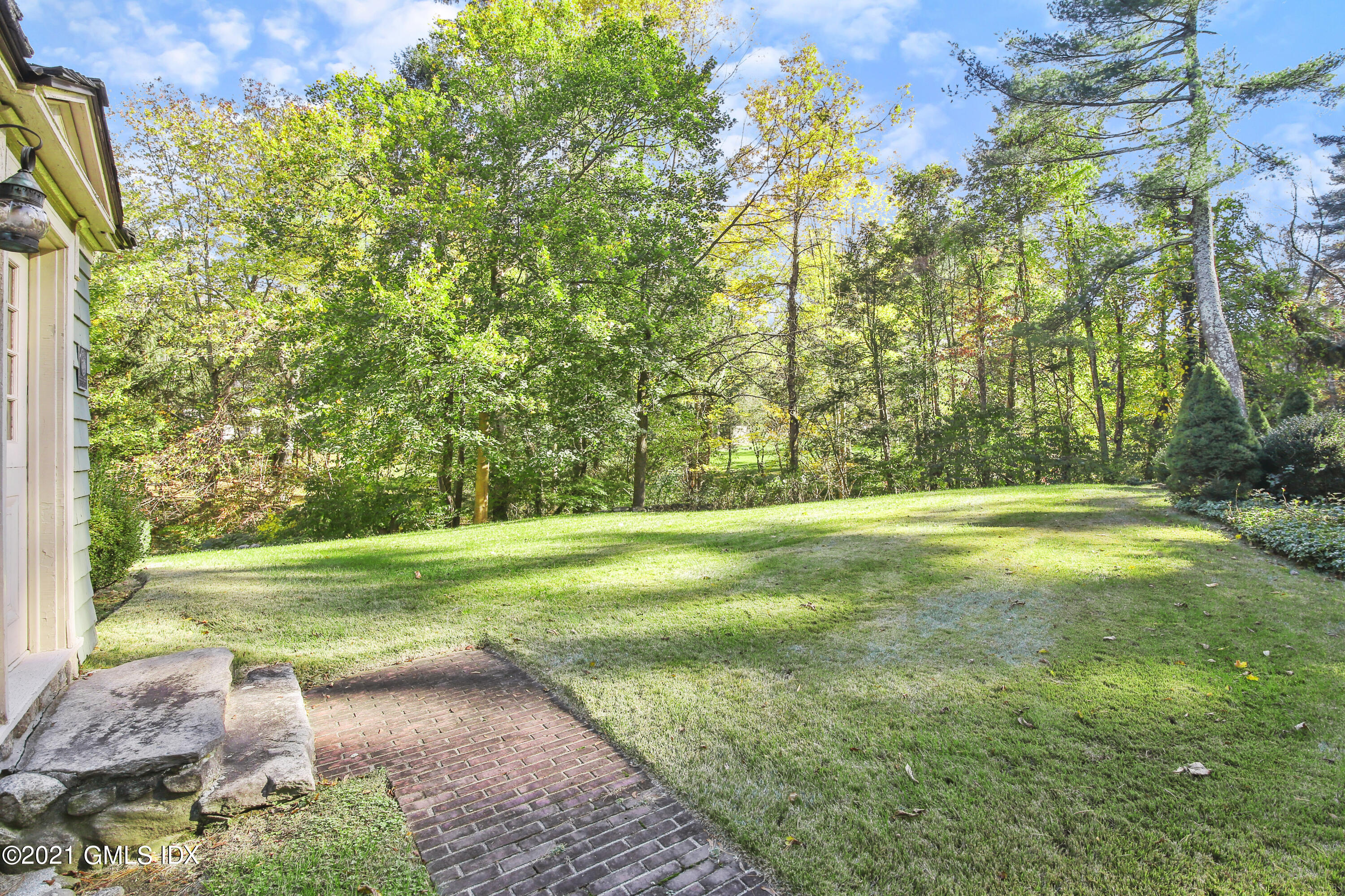 117 Dingletown Road Greenwich, CT 06830 - Photo 20 of 25 a view of a yard with a large trees