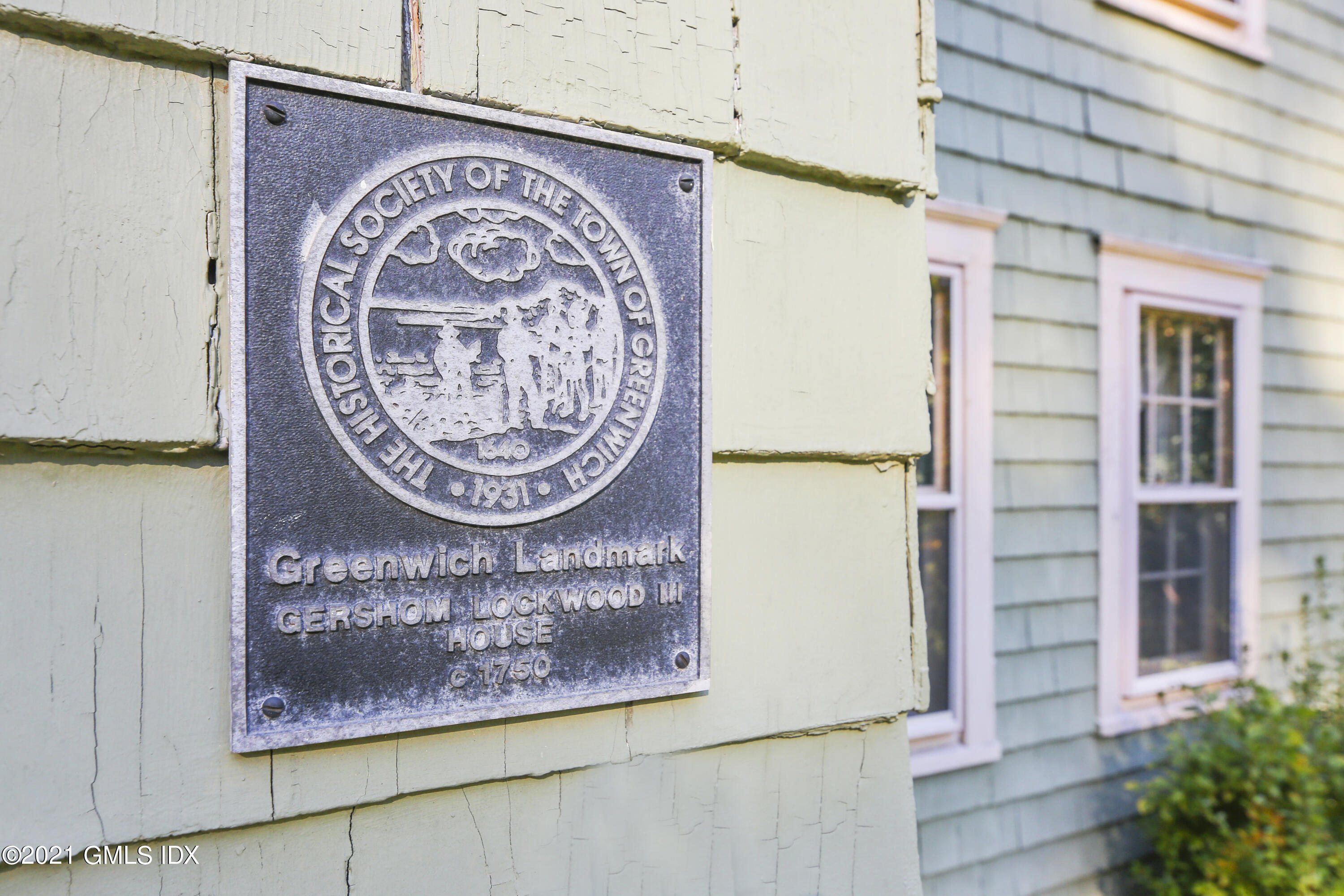 117 Dingletown Road Greenwich, CT 06830 - Photo 22 of 25 a view of a hallway with washer and dryer