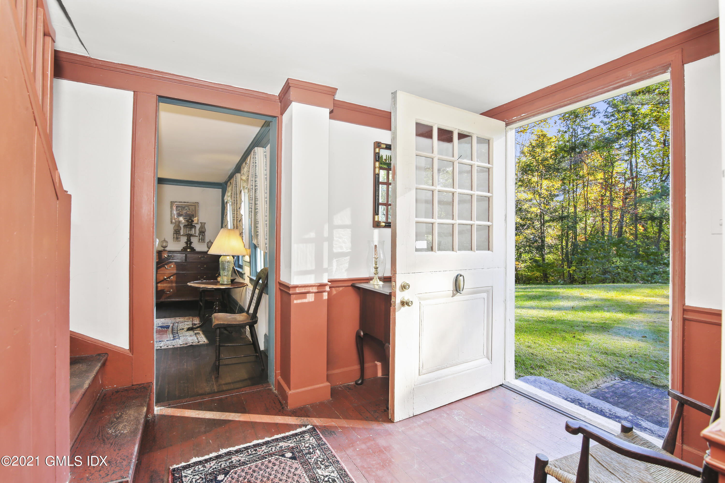 117 Dingletown Road Greenwich, CT 06830 - Photo 4 of 25 a very nice looking room with a large window and a view of bedroom with balcony