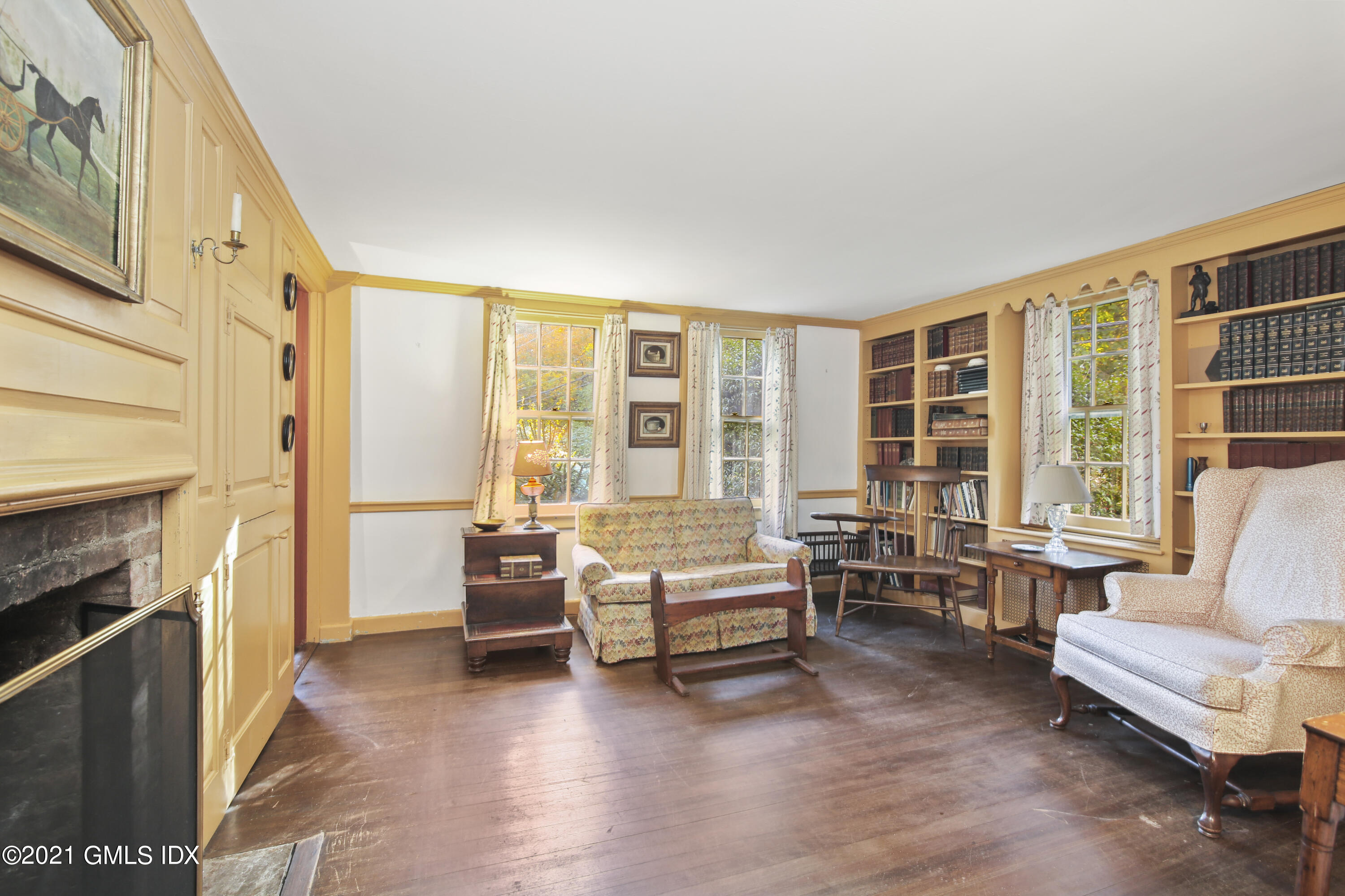 117 Dingletown Road Greenwich, CT 06830 - Photo 9 of 25 a living room with furniture and a fireplace