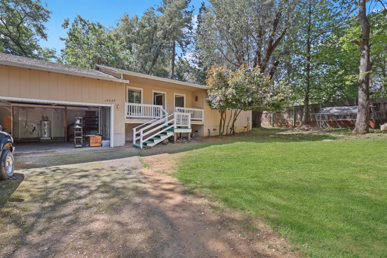 19688 Murphy Road Pine Grove, CA 95665 - Photo 1 of 8 a front view of a house with garden