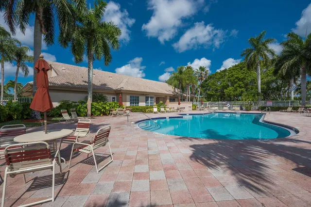 a view of a swimming pool with a patio