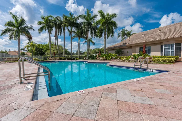 a view of a swimming pool with a patio