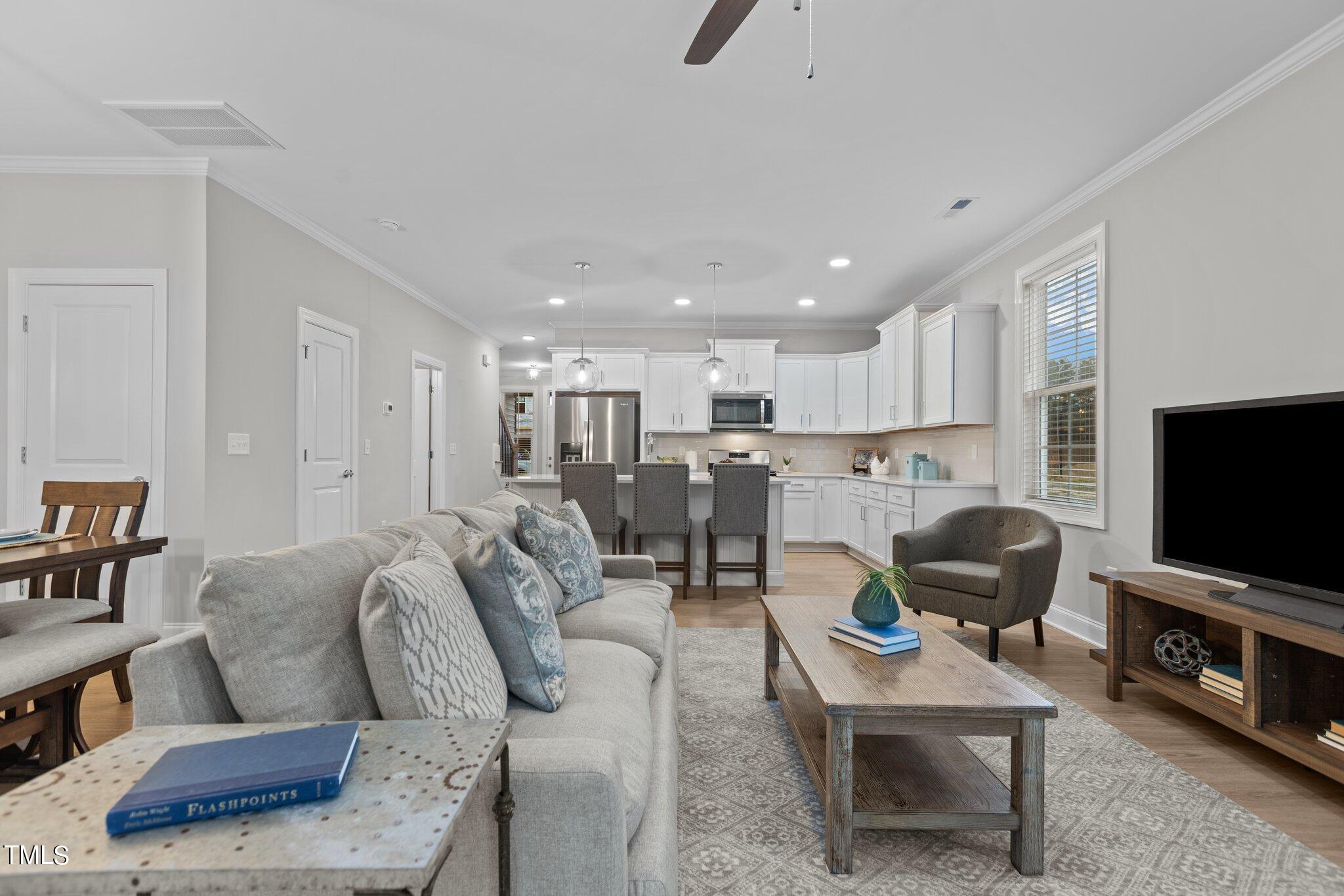 603 Marshskip Way Rolesville, NC 27571 - Photo 11 of 30 a living room with furniture and a flat screen tv