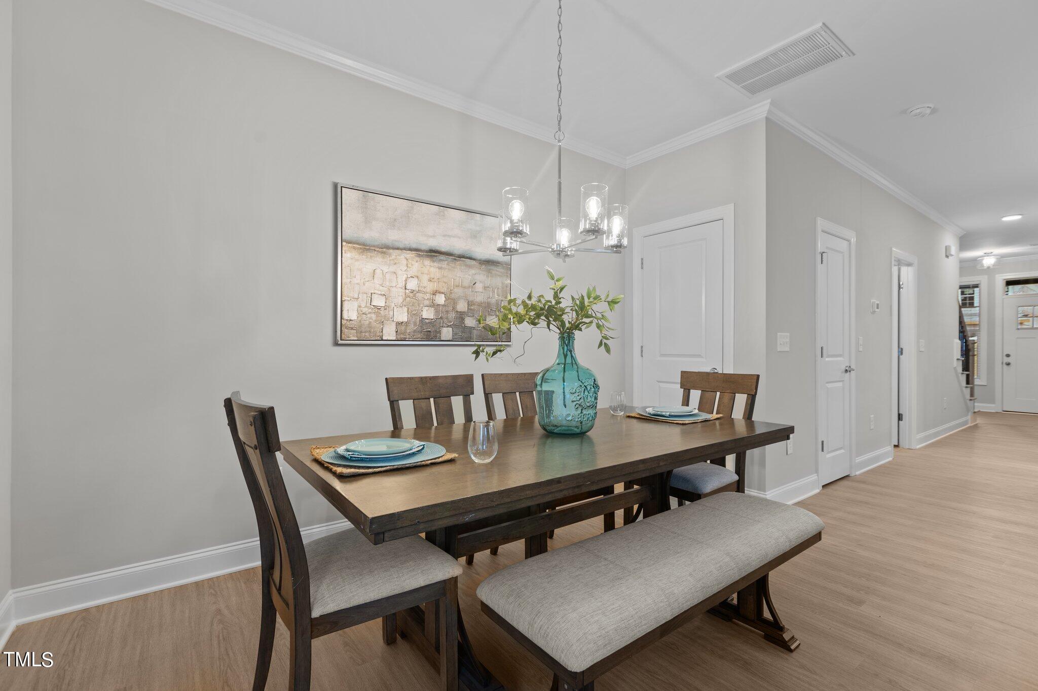 603 Marshskip Way Rolesville, NC 27571 - Photo 12 of 30 a dining room with furniture and chandelier