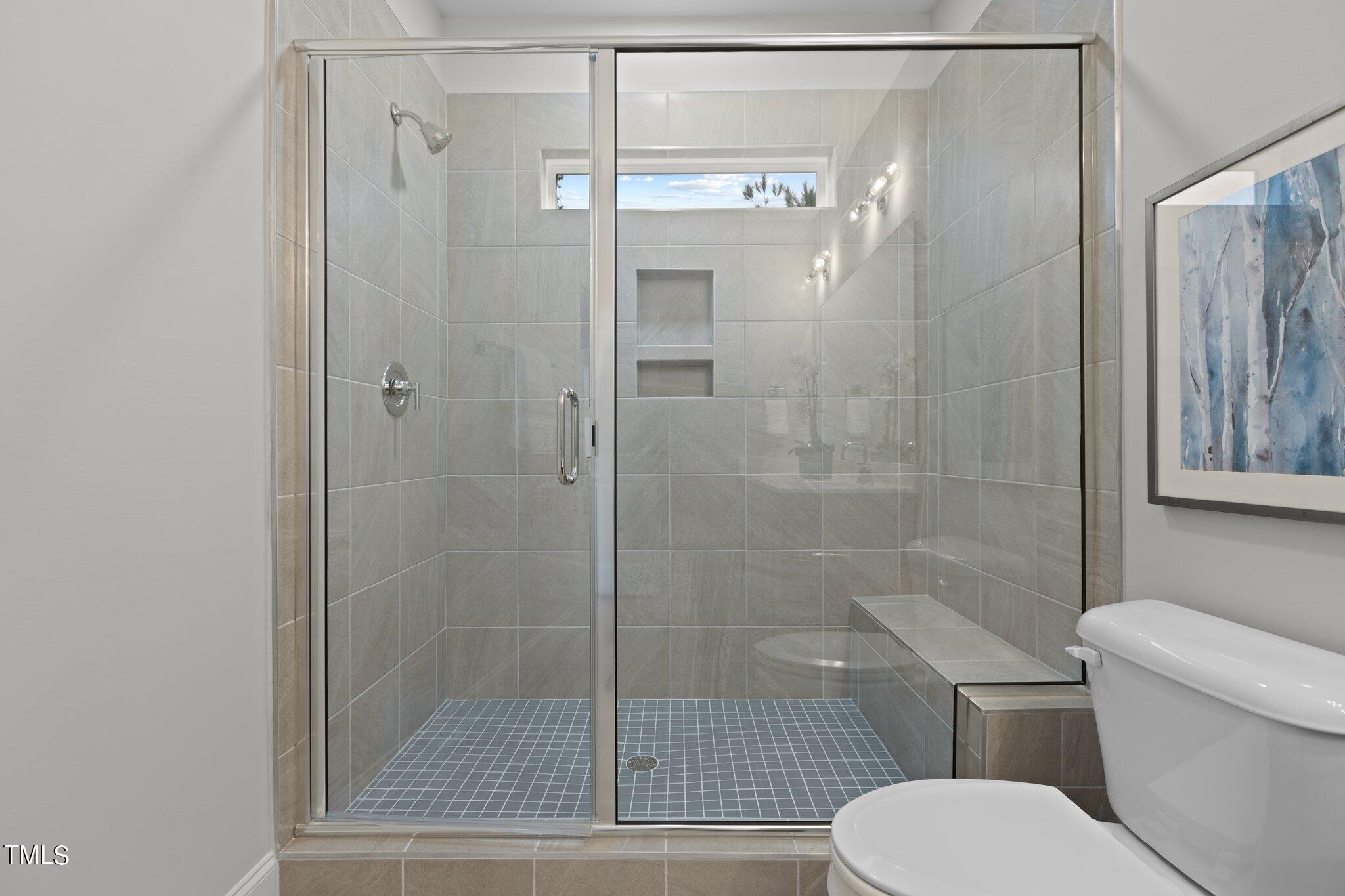 603 Marshskip Way Rolesville, NC 27571 - Photo 20 of 30 a bathroom with a shower and a toilet
