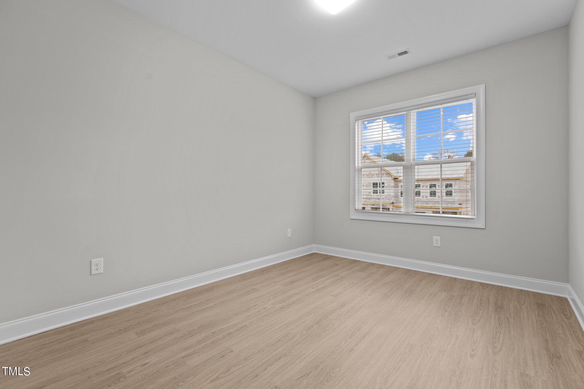 603 Marshskip Way Rolesville, NC 27571 - Photo 24 of 30 a view of an empty room with a window