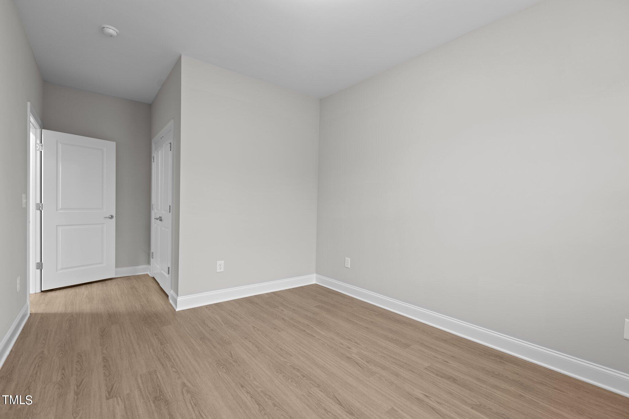 603 Marshskip Way Rolesville, NC 27571 - Photo 25 of 30 a view of an empty room with wooden floor