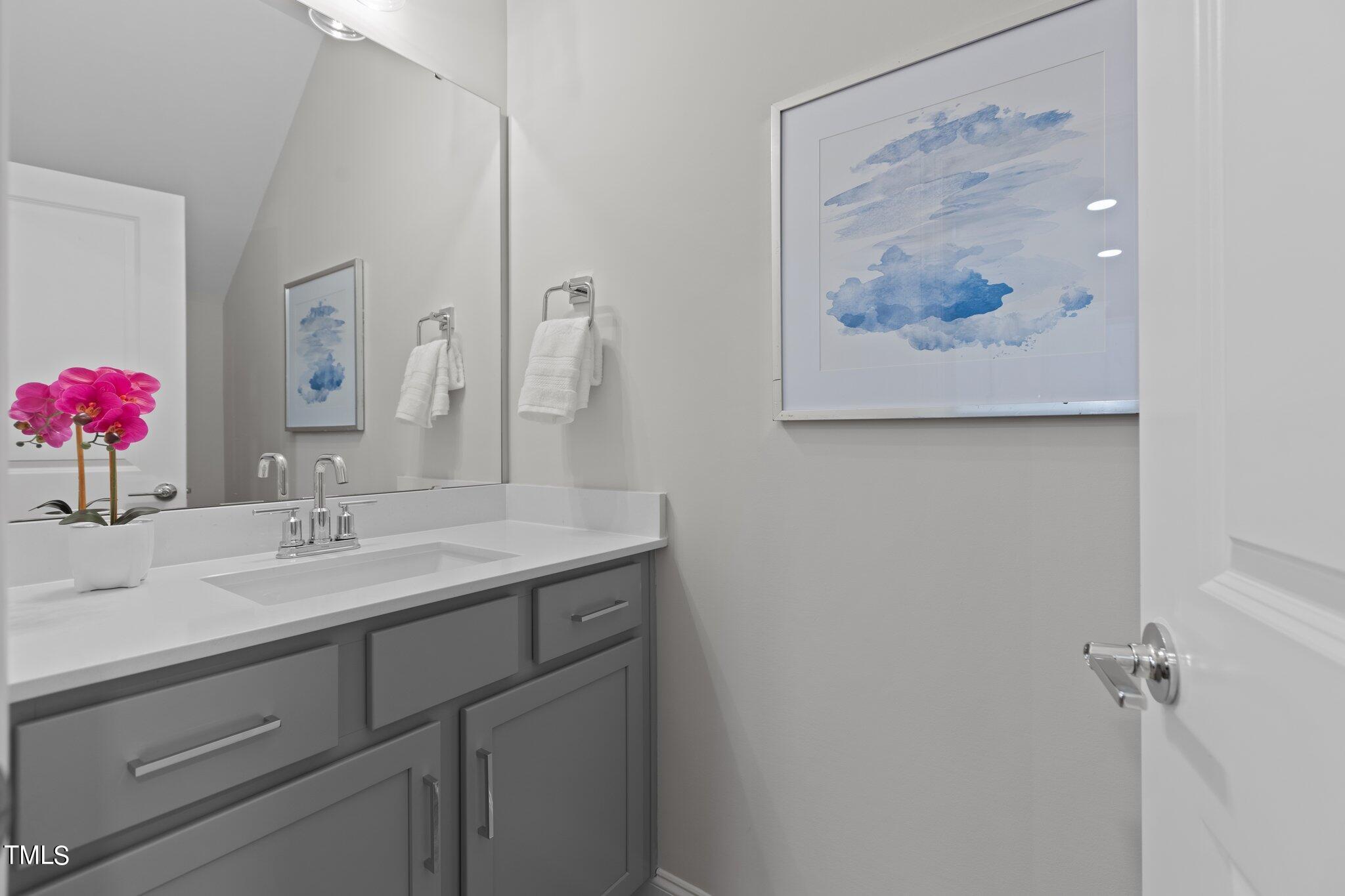 603 Marshskip Way Rolesville, NC 27571 - Photo 4 of 30 a bathroom with a granite countertop sink a mirror and vanity