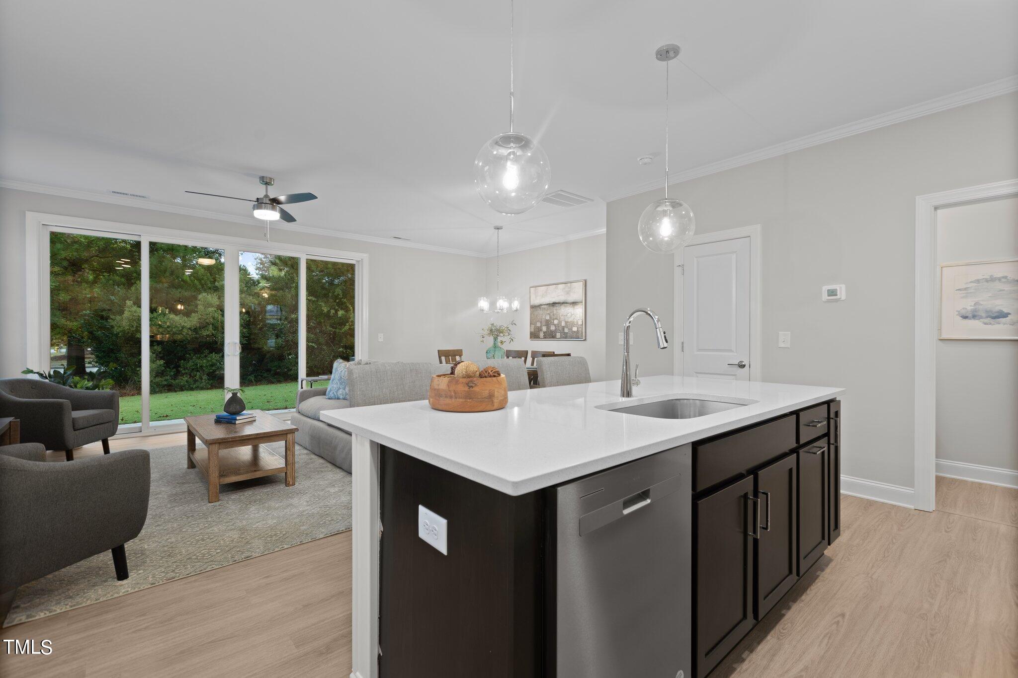 603 Marshskip Way Rolesville, NC 27571 - Photo 8 of 30 a hall with kitchen island a sink and a large window