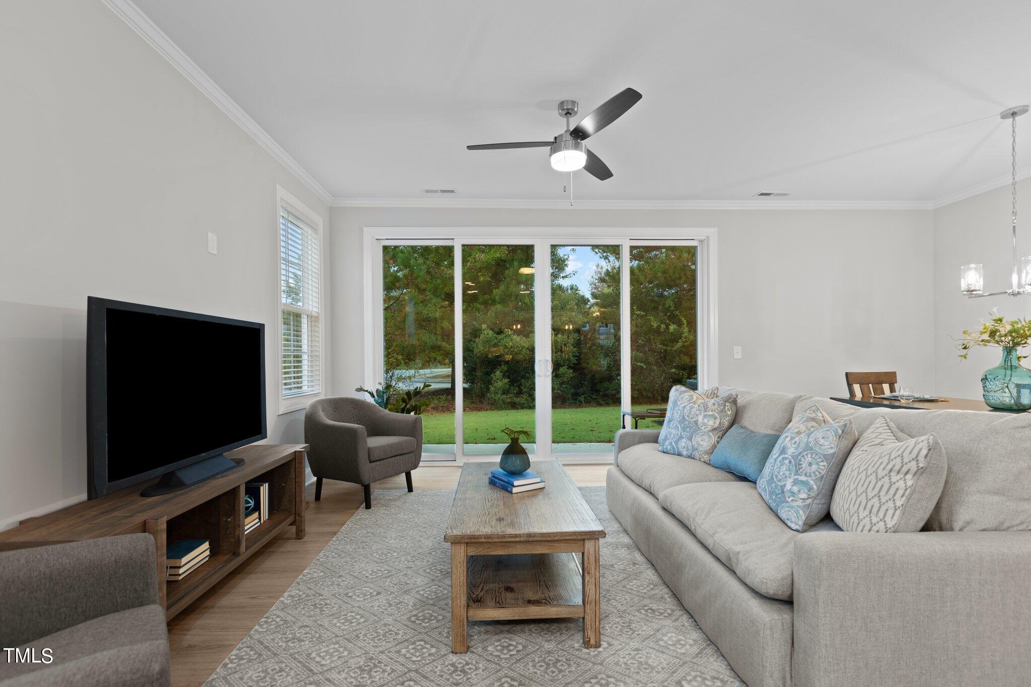 603 Marshskip Way Rolesville, NC 27571 - Photo 9 of 30 a living room with furniture and a flat screen tv