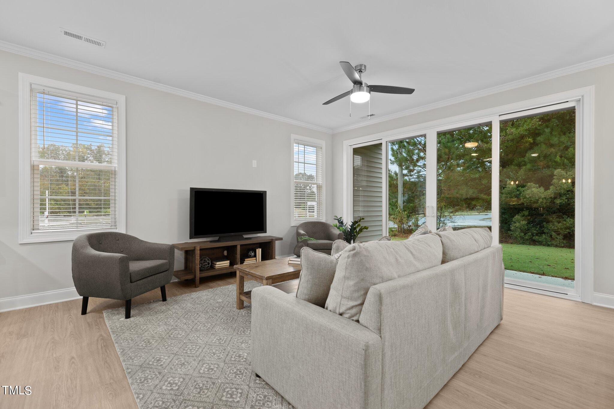 603 Marshskip Way Rolesville, NC 27571 - Photo 10 of 30 a living room with furniture and a flat screen tv
