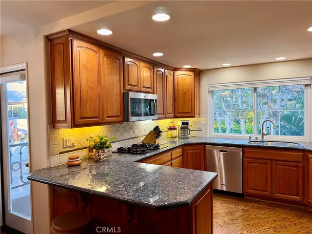 a view of a dining room with furniture and windows