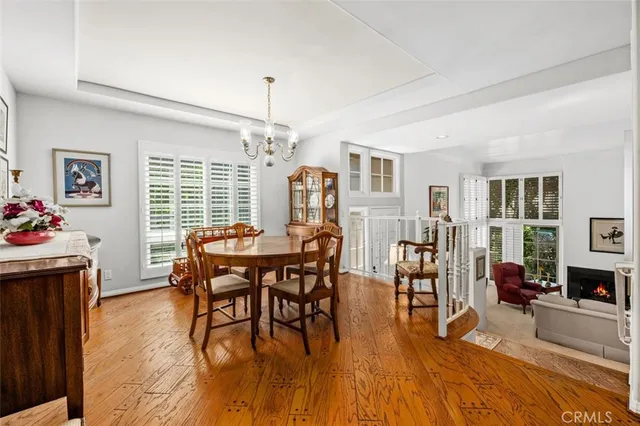 a view of a livingroom with workspace and a window