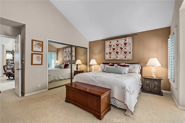 a bathroom with a granite countertop sink a mirror a bathtub and shower