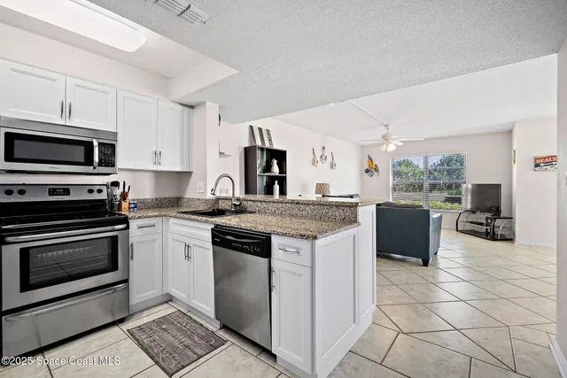 a kitchen with a stove and a microwave