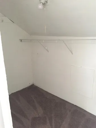 a view of a room with racks on the wall