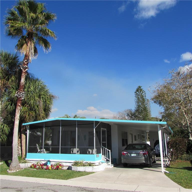 6001 Peony Road Venice, FL 34293 - Photo 1 of 1 a front view of house with yard