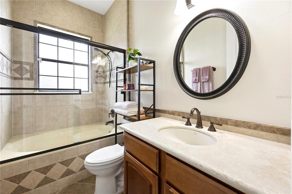 11325 Preston Cove Road Clermont, FL 34711 - Photo 39 of 58 a bathroom with a sink and a mirror