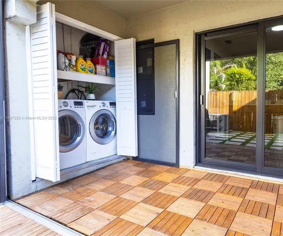 a view of a living room with washer and dryer