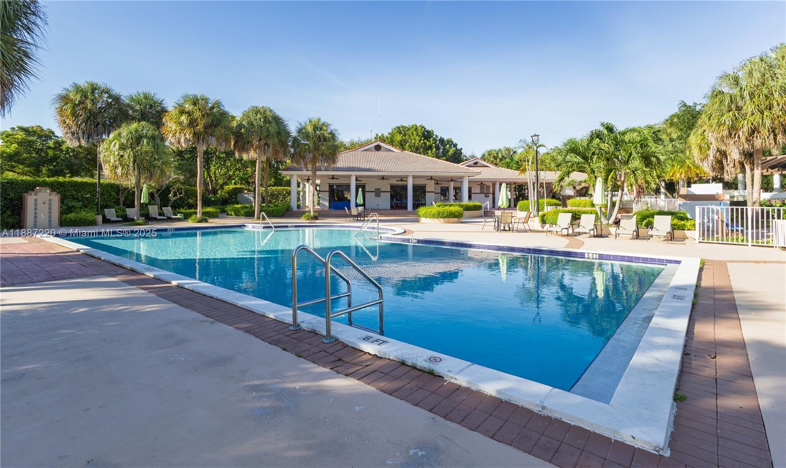 15365 Southwest 104th Terrace, Unit 2 Miami, FL 33196 - Photo 22 of 34 a view of a swimming pool with a patio
