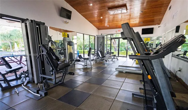 a view of a patio with table and chairs