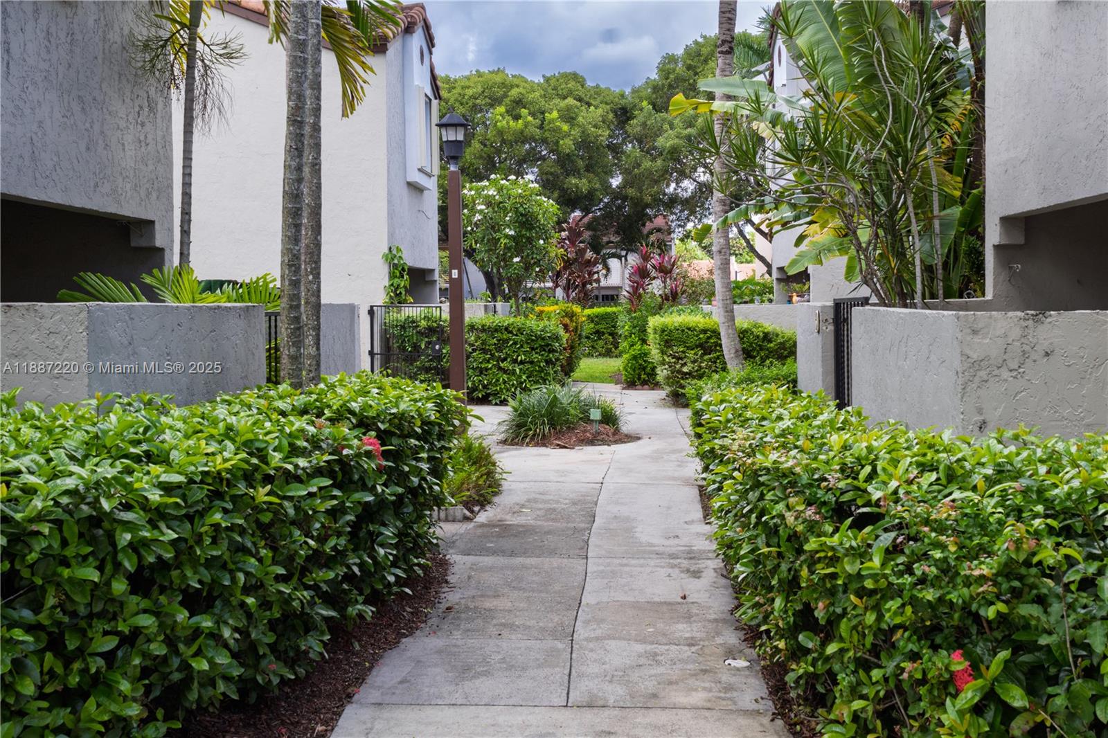 15365 Southwest 104th Terrace, Unit 2 Miami, FL 33196 - Photo 3 of 34 front view of a house with a yard