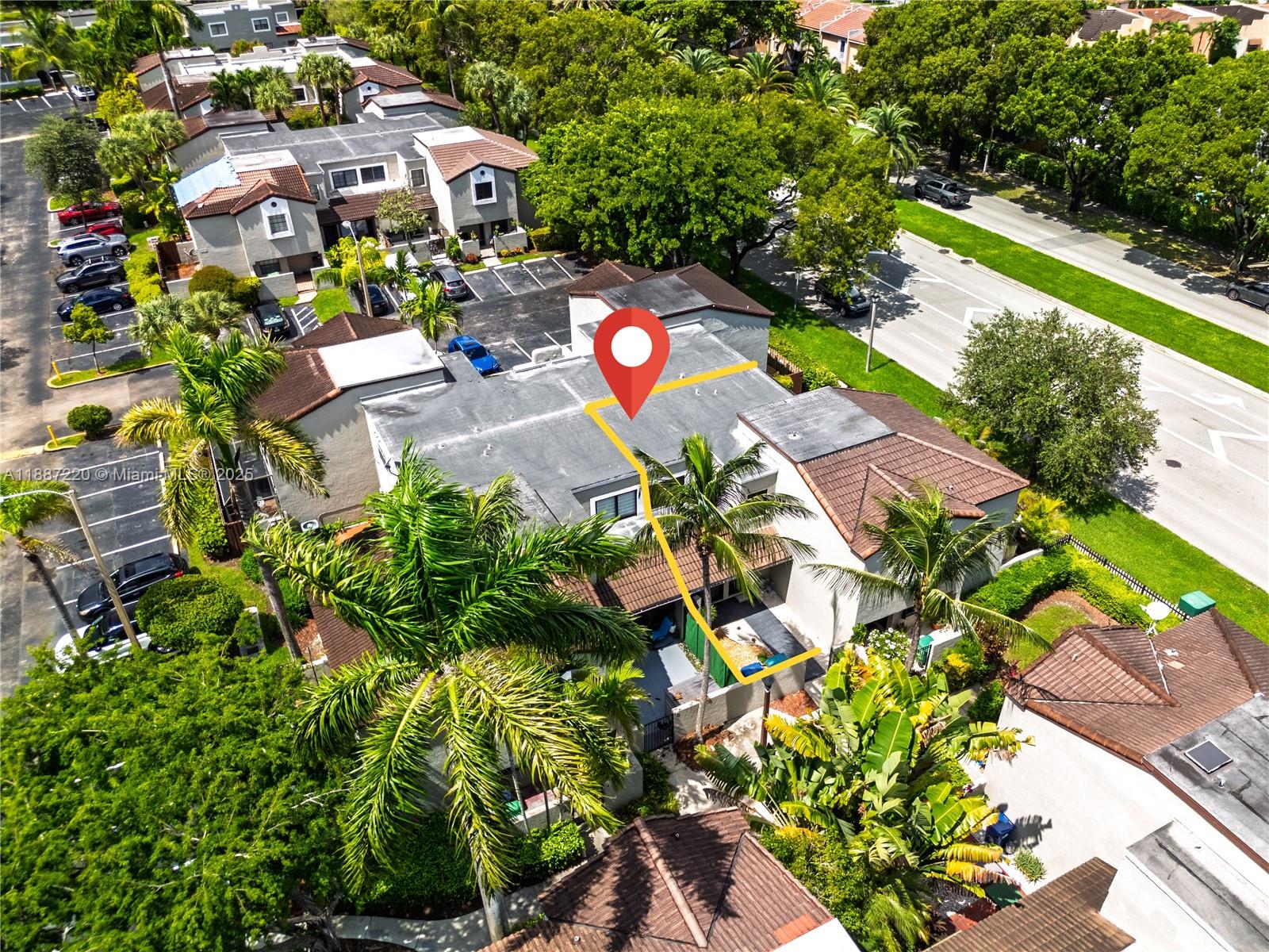 15365 Southwest 104th Terrace, Unit 2 Miami, FL 33196 - Photo 32 of 34 an aerial view of a house with a yard and garden