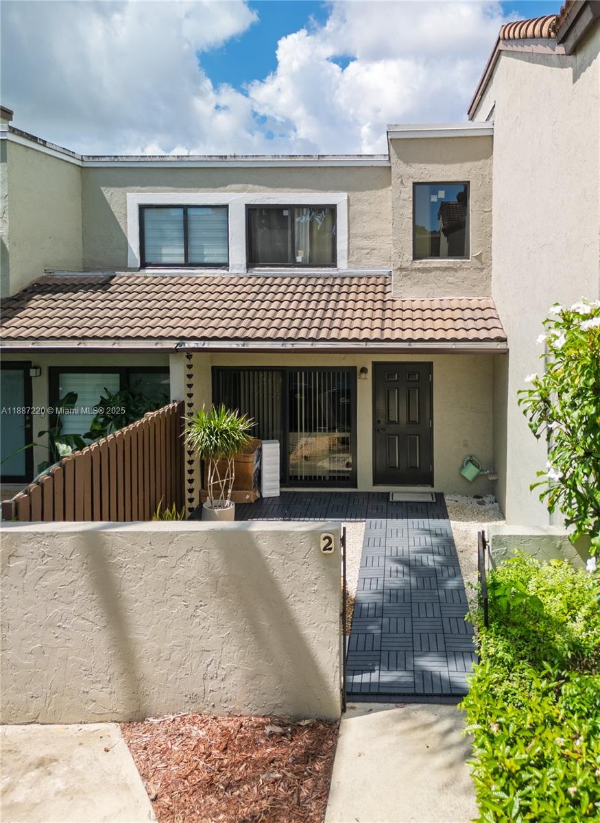 15365 Southwest 104th Terrace, Unit 2 Miami, FL 33196 - Photo 34 of 34 a front view of a house with a porch