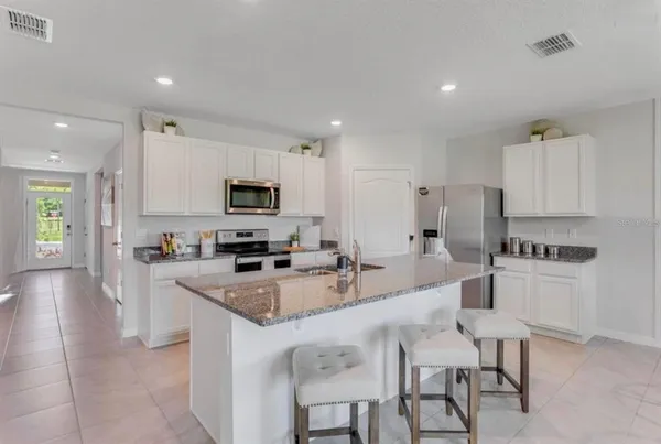a large kitchen with cabinets