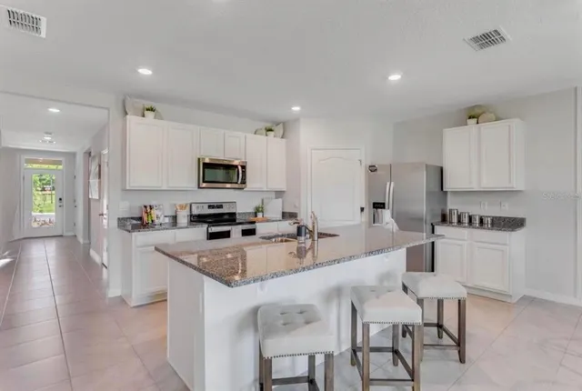 a large kitchen with cabinets