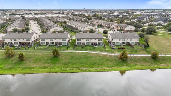 an aerial view of a house with a lake view