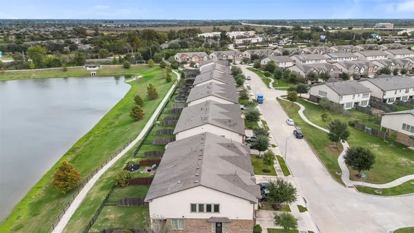 an aerial view of a house with a lake view