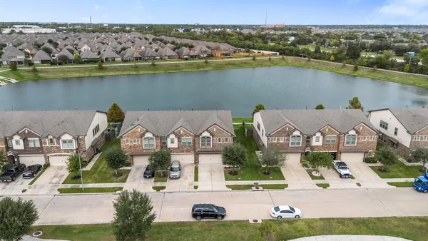 an aerial view of a house with a lake view