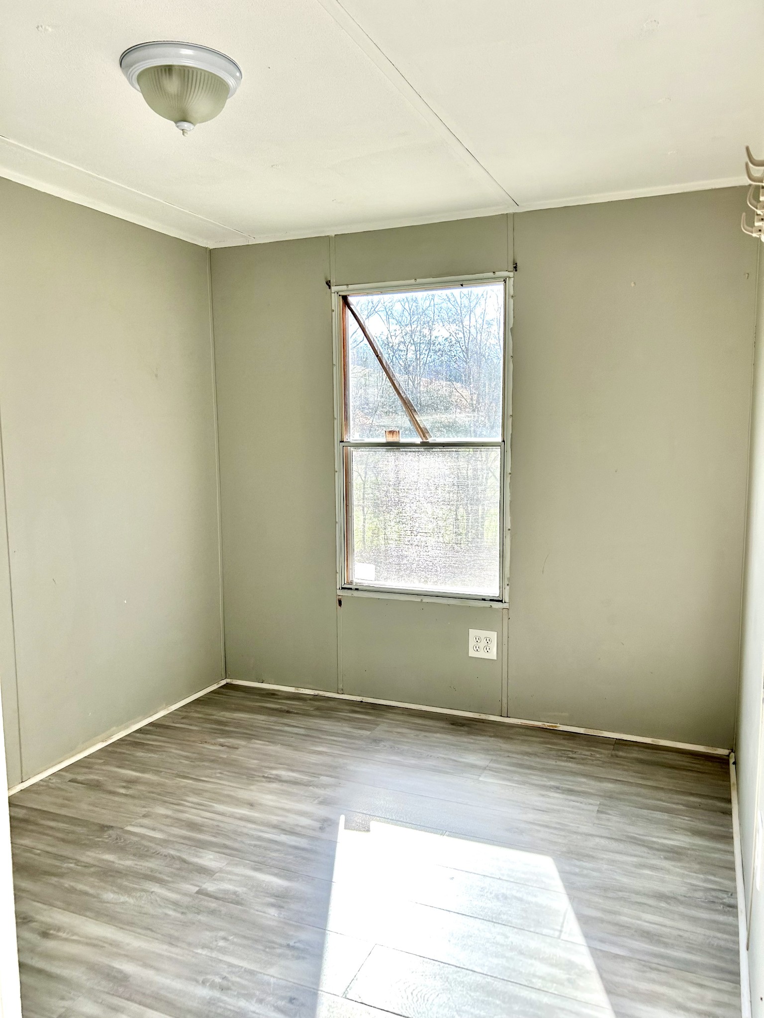 6206 Beech Hill Road Pulaski, TN 38478 - Photo 6 of 8 an empty room with wooden floor and windows