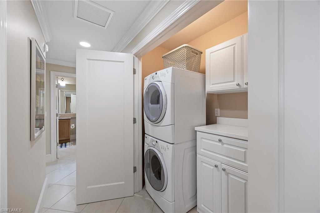 9115 Strada Place, Unit 5213 Naples, FL 34108 - Photo 22 of 32 a utility room with dryer and washer