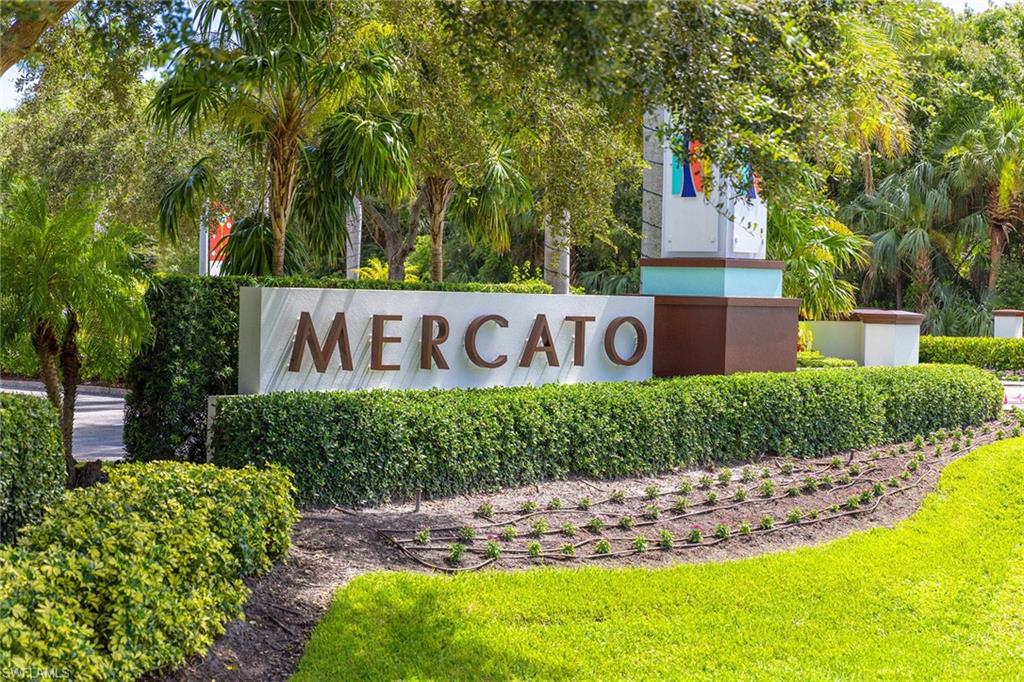 9115 Strada Place, Unit 5213 Naples, FL 34108 - Photo 32 of 32 a sign that is sitting in front of a house with large trees