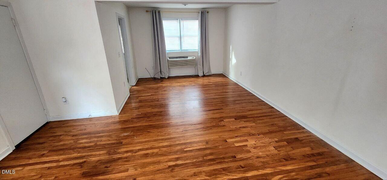 1041 St Marys Street Raleigh, NC 27605 - Photo 4 of 9 a view of a hallway with wooden floor