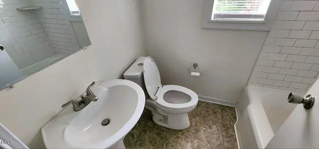a bathroom with a sink and a toilet