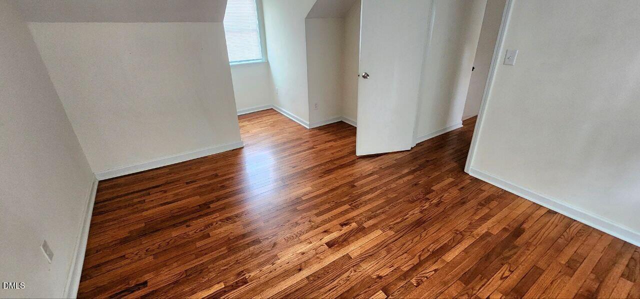 1041 St Marys Street Raleigh, NC 27605 - Photo 7 of 9 a view of a room with wooden floor
