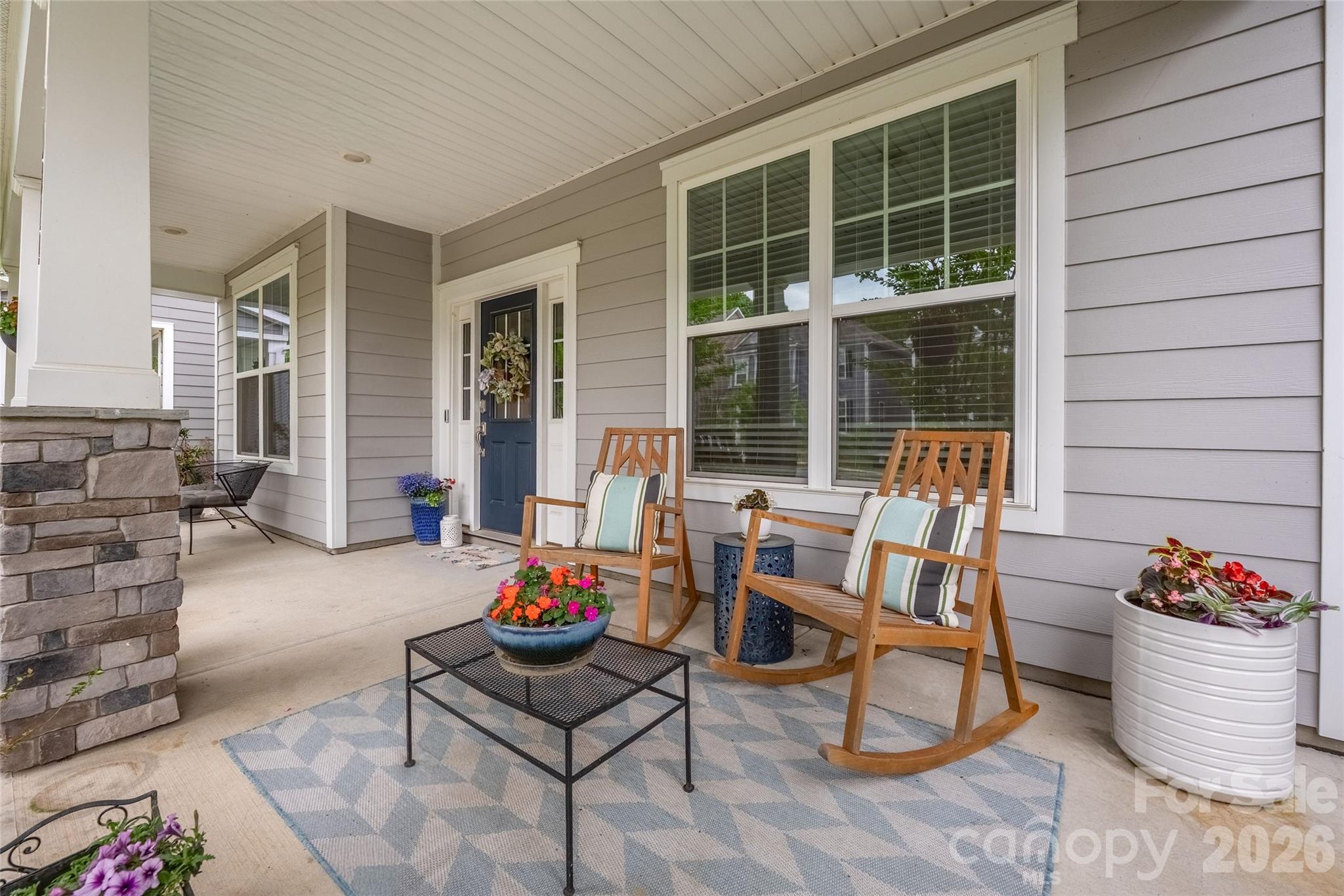 17219 Shearer Road Davidson, NC 28036 - Photo 4 of 34 a outdoor space with patio the couches and a potted plant with the kitchen view