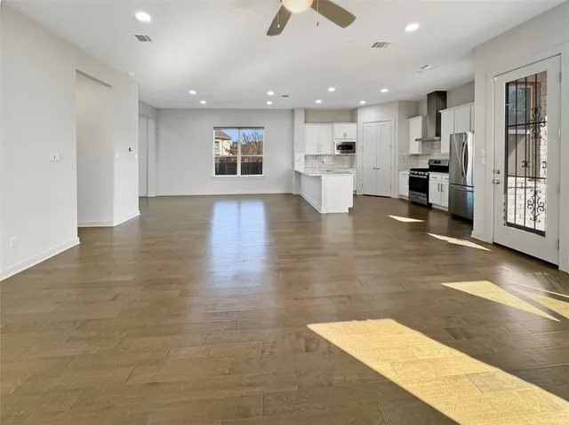 a view of a kitchen with a sink and a stove top oven