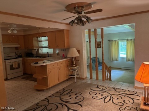 5514 Detroit Road Elyria, OH 44035 - Photo 5 of 8 Kitchen featuring ceiling fan, white stove, light countertops, light tile patterned floors, and ornamental molding