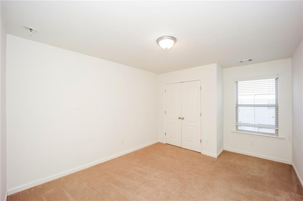 7638 Bucknell Terrace Fairburn, GA 30213 - Photo 12 of 17 an empty room with windows