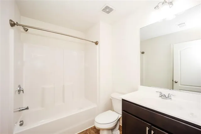 a view of a house with a yard and plants