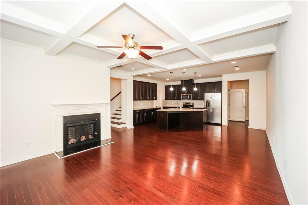 7638 Bucknell Terrace Fairburn, GA 30213 - Photo 7 of 17 a view of kitchen with a sink and a fireplace